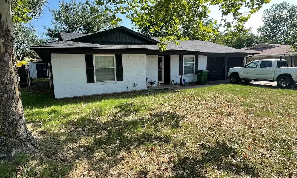 Professional roofing crew working on a residential roof in Canal Winchester